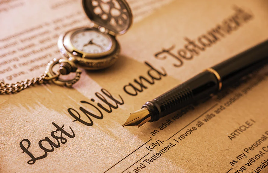 Last Will and Testament document with a fountain pen and pocket watch