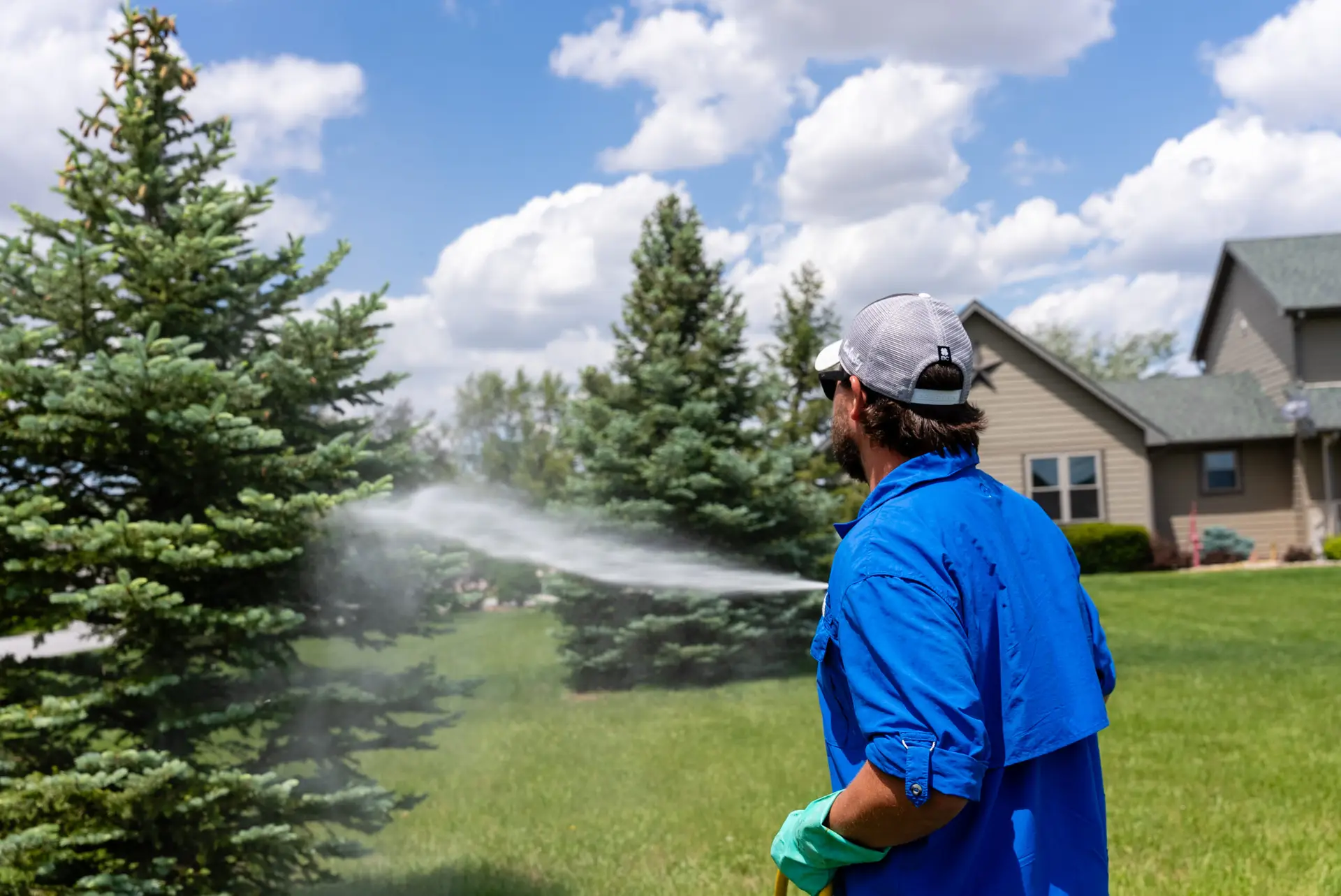 Lush spring lawn on a Lincoln NE property representing the healthy deep-rooted turf Yard Boss helps Lancaster County homeowners build through smart May watering practices